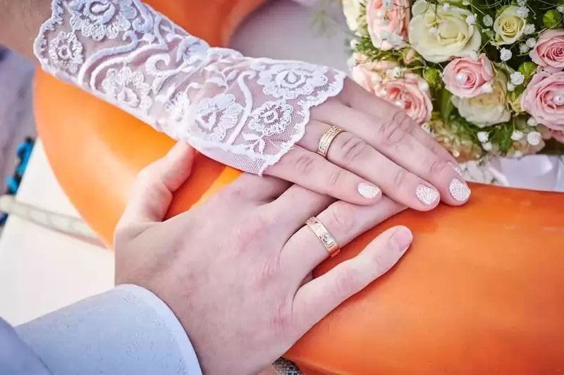 Just married couple hands with rings