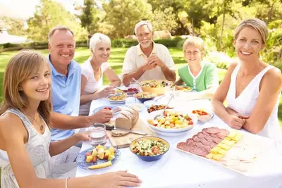 family at picnic table outdoors